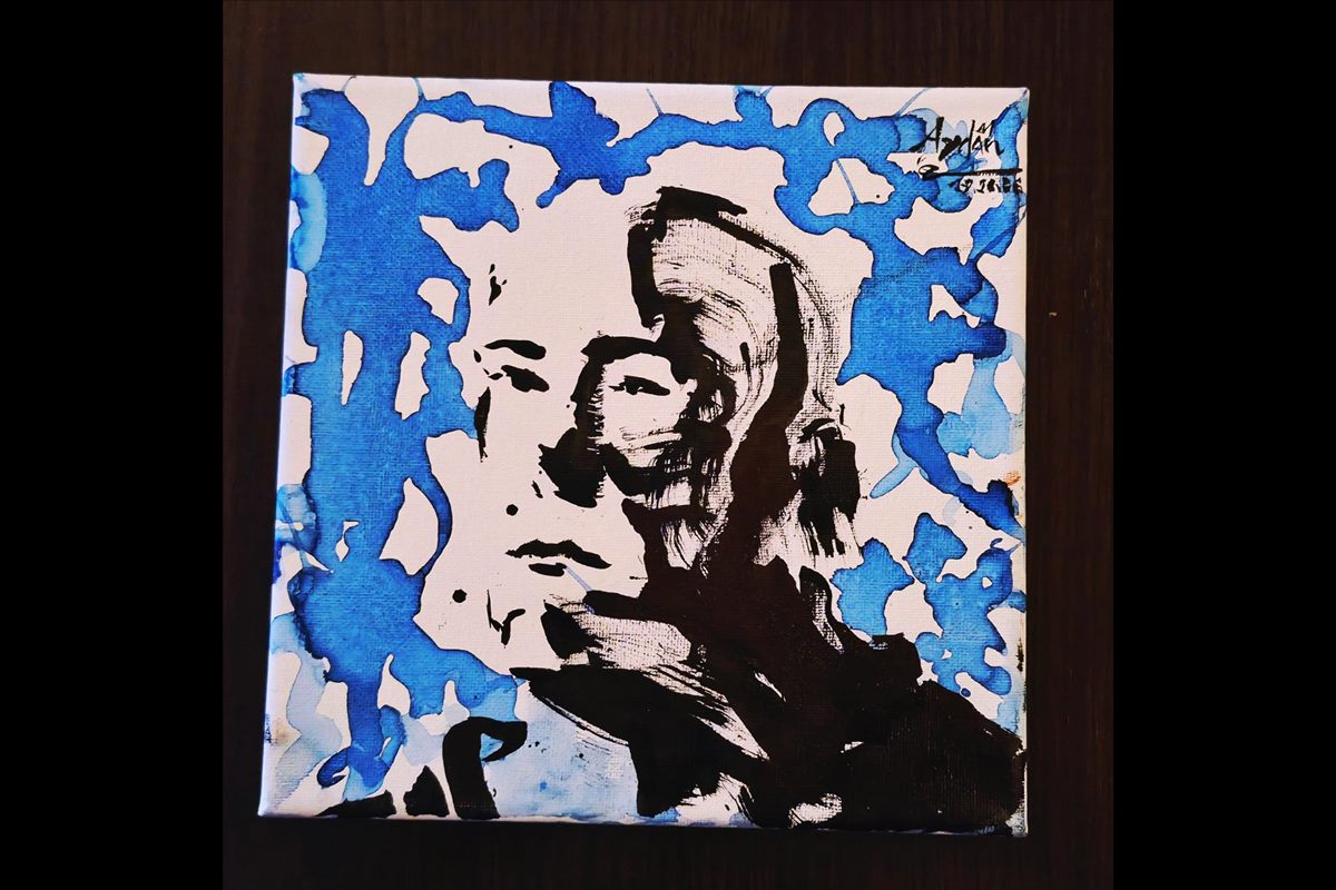Expressive portrait with blue paint splashes and black ink