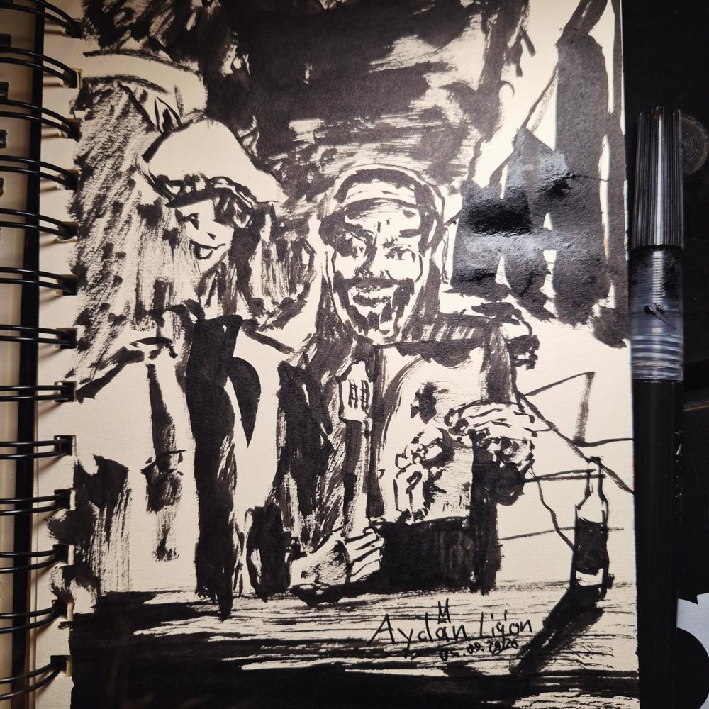 The ink drawing framed next to it on the wall